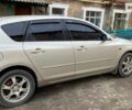 Бежевый Мазда 3, объемом двигателя 1.6 л и пробегом 299 тыс. км за 5711 $, фото 1 на Automoto.ua