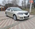Бежевый Мазда 3, объемом двигателя 2.02 л и пробегом 216 тыс. км за 5000 $, фото 1 на Automoto.ua