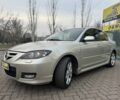 Бежевый Мазда 3, объемом двигателя 2 л и пробегом 184 тыс. км за 5350 $, фото 2 на Automoto.ua