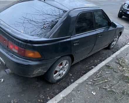 Черный Мазда 3, объемом двигателя 1.8 л и пробегом 313 тыс. км за 674 $, фото 3 на Automoto.ua