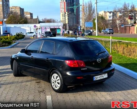 Черный Мазда 3, объемом двигателя 1.3 л и пробегом 200 тыс. км за 3799 $, фото 4 на Automoto.ua