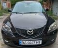 Черный Мазда 3, объемом двигателя 1.6 л и пробегом 210 тыс. км за 5600 $, фото 1 на Automoto.ua