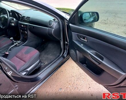 Черный Мазда 3, объемом двигателя 2 л и пробегом 250 тыс. км за 5200 $, фото 5 на Automoto.ua