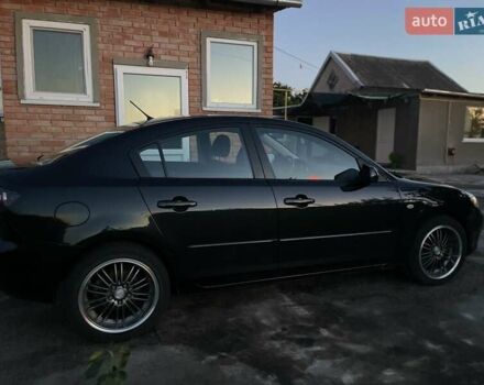 Черный Мазда 3, объемом двигателя 1.6 л и пробегом 173 тыс. км за 6300 $, фото 3 на Automoto.ua