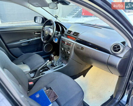 Черный Мазда 3, объемом двигателя 1.6 л и пробегом 210 тыс. км за 3950 $, фото 11 на Automoto.ua