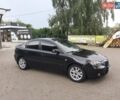 Черный Мазда 3, объемом двигателя 1.6 л и пробегом 183 тыс. км за 5800 $, фото 1 на Automoto.ua