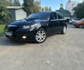Черный Мазда 3, объемом двигателя 1.6 л и пробегом 153 тыс. км за 5700 $, фото 1 на Automoto.ua