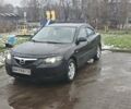 Черный Мазда 3, объемом двигателя 1.6 л и пробегом 205 тыс. км за 5600 $, фото 1 на Automoto.ua