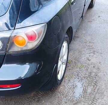 Черный Мазда 3, объемом двигателя 1.6 л и пробегом 260 тыс. км за 2800 $, фото 1 на Automoto.ua