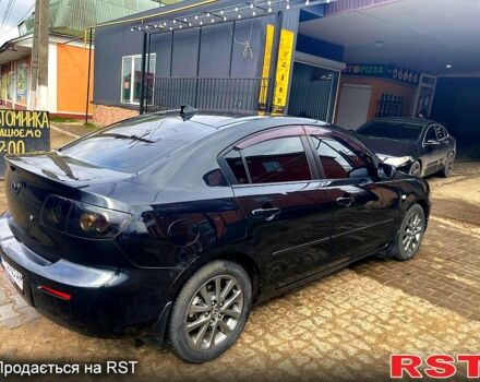 Черный Мазда 3, объемом двигателя 2 л и пробегом 230 тыс. км за 6100 $, фото 1 на Automoto.ua