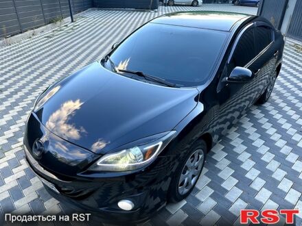 Черный Мазда 3, объемом двигателя 2 л и пробегом 280 тыс. км за 6950 $, фото 1 на Automoto.ua