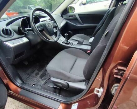 Коричневий Мазда 3, об'ємом двигуна 1.6 л та пробігом 65 тис. км за 9500 $, фото 13 на Automoto.ua