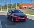 Красный Мазда 3, объемом двигателя 1.6 л и пробегом 229 тыс. км за 4650 $, фото 1 на Automoto.ua