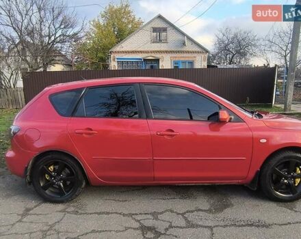 Красный Мазда 3, объемом двигателя 2 л и пробегом 256 тыс. км за 4800 $, фото 2 на Automoto.ua