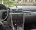 Червоний Мазда 3, об'ємом двигуна 1.4 л та пробігом 310 тис. км за 4100 $, фото 1 на Automoto.ua