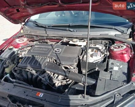 Червоний Мазда 3, об'ємом двигуна 1.35 л та пробігом 173 тис. км за 6200 $, фото 3 на Automoto.ua