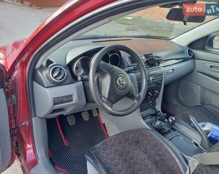 Червоний Мазда 3, об'ємом двигуна 1.35 л та пробігом 173 тис. км за 6200 $, фото 2 на Automoto.ua