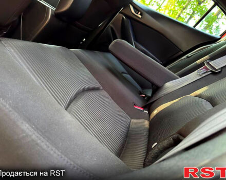 Красный Мазда 3, объемом двигателя 2 л и пробегом 143 тыс. км за 9350 $, фото 8 на Automoto.ua