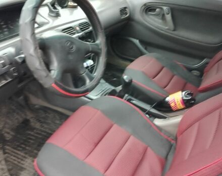 Красный Мазда 3, объемом двигателя 1.8 л и пробегом 320 тыс. км за 1700 $, фото 6 на Automoto.ua