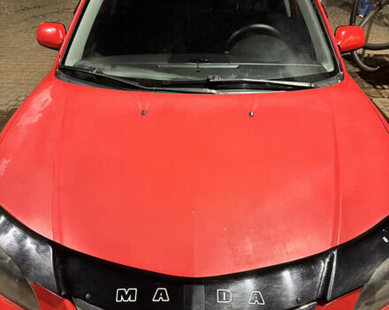 Красный Мазда 3, объемом двигателя 1.6 л и пробегом 234 тыс. км за 3999 $, фото 1 на Automoto.ua