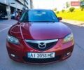 Красный Мазда 3, объемом двигателя 1.6 л и пробегом 315 тыс. км за 3999 $, фото 1 на Automoto.ua