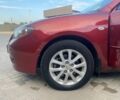 Красный Мазда 3, объемом двигателя 2 л и пробегом 220 тыс. км за 6700 $, фото 3 на Automoto.ua