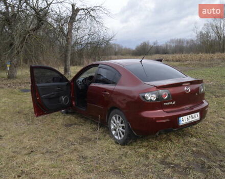 Красный Мазда 3, объемом двигателя 1.6 л и пробегом 247 тыс. км за 5800 $, фото 4 на Automoto.ua