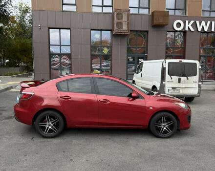 Красный Мазда 3, объемом двигателя 2 л и пробегом 217 тыс. км за 6699 $, фото 3 на Automoto.ua