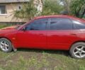 Червоний Мазда 3, об'ємом двигуна 1.8 л та пробігом 320 тис. км за 1692 $, фото 1 на Automoto.ua