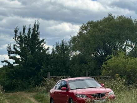 Красный Мазда 3, объемом двигателя 1.6 л и пробегом 269 тыс. км за 4000 $, фото 1 на Automoto.ua