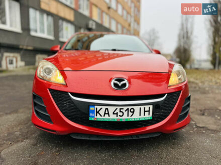 Красный Мазда 3, объемом двигателя 2 л и пробегом 199 тыс. км за 6800 $, фото 1 на Automoto.ua