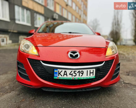 Красный Мазда 3, объемом двигателя 2 л и пробегом 199 тыс. км за 6800 $, фото 1 на Automoto.ua