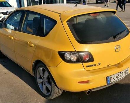 Желтый Мазда 3, объемом двигателя 2 л и пробегом 270 тыс. км за 4000 $, фото 2 на Automoto.ua