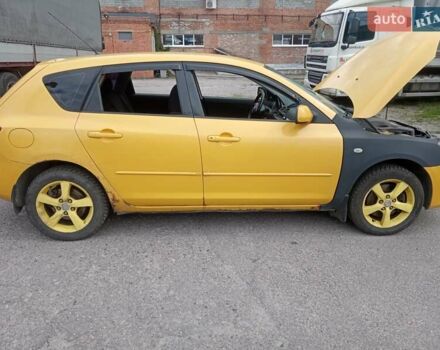Желтый Мазда 3, объемом двигателя 2 л и пробегом 330 тыс. км за 2800 $, фото 6 на Automoto.ua