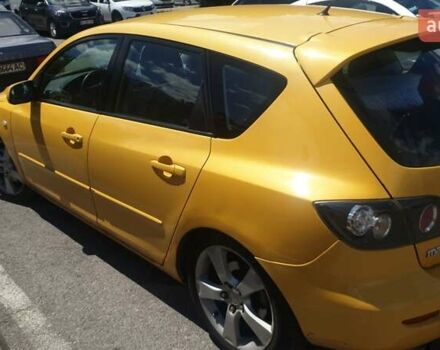 Желтый Мазда 3, объемом двигателя 2 л и пробегом 270 тыс. км за 4000 $, фото 4 на Automoto.ua