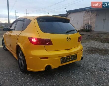 Желтый Мазда 3, объемом двигателя 1.6 л и пробегом 205 тыс. км за 5550 $, фото 7 на Automoto.ua