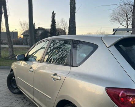 Жовтий Мазда 3, об'ємом двигуна 1.56 л та пробігом 190 тис. км за 3399 $, фото 3 на Automoto.ua