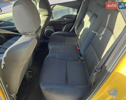 Желтый Мазда 3, объемом двигателя 2 л и пробегом 195 тыс. км за 6400 $, фото 11 на Automoto.ua