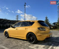Желтый Мазда 3, объемом двигателя 2 л и пробегом 195 тыс. км за 6400 $, фото 6 на Automoto.ua