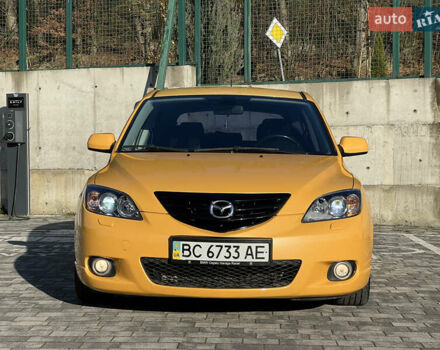 Желтый Мазда 3, объемом двигателя 2 л и пробегом 195 тыс. км за 6400 $, фото 1 на Automoto.ua