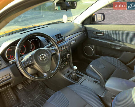 Желтый Мазда 3, объемом двигателя 2 л и пробегом 195 тыс. км за 6400 $, фото 9 на Automoto.ua
