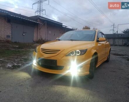 Желтый Мазда 3, объемом двигателя 1.6 л и пробегом 205 тыс. км за 5550 $, фото 1 на Automoto.ua