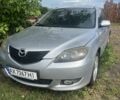 Сірий Мазда 3, об'ємом двигуна 2 л та пробігом 250 тис. км за 1000 $, фото 1 на Automoto.ua