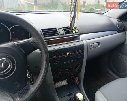 Серый Мазда 3, объемом двигателя 1.3 л и пробегом 228 тыс. км за 2800 $, фото 1 на Automoto.ua