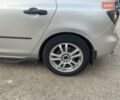 Серый Мазда 3, объемом двигателя 1.3 л и пробегом 221 тыс. км за 4999 $, фото 1 на Automoto.ua