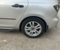Сірий Мазда 3, об'ємом двигуна 1.3 л та пробігом 217 тис. км за 4999 $, фото 4 на Automoto.ua