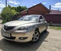 Серый Мазда 3, объемом двигателя 1.6 л и пробегом 249 тыс. км за 4500 $, фото 1 на Automoto.ua