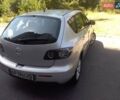 Серый Мазда 3, объемом двигателя 1.56 л и пробегом 174 тыс. км за 6000 $, фото 1 на Automoto.ua