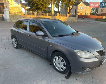 Серый Мазда 3, объемом двигателя 2 л и пробегом 300 тыс. км за 6500 $, фото 1 на Automoto.ua