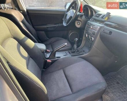 Серый Мазда 3, объемом двигателя 2 л и пробегом 301 тыс. км за 5400 $, фото 12 на Automoto.ua